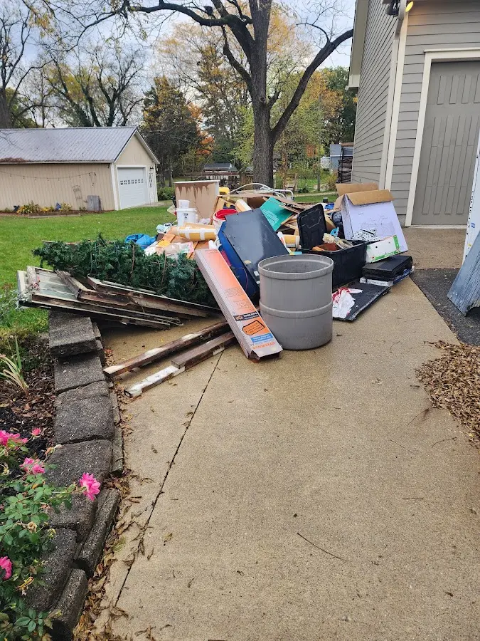 Dumpster being loaded with debris for Roofing Dumpster Rental in Del Mar